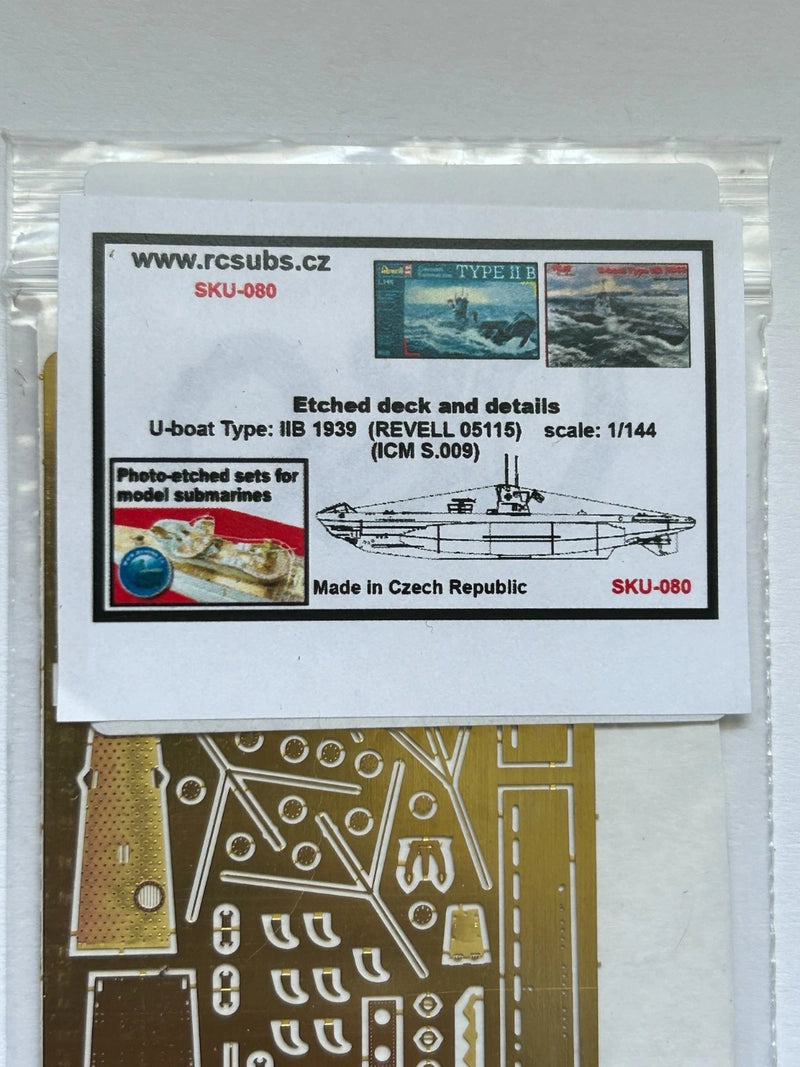 Photo of photo-etched brass parts upgrade set for German U-Boat Type IIB 1:144 scale by Revell and ICM, featuring railings, ladders, and deck details.