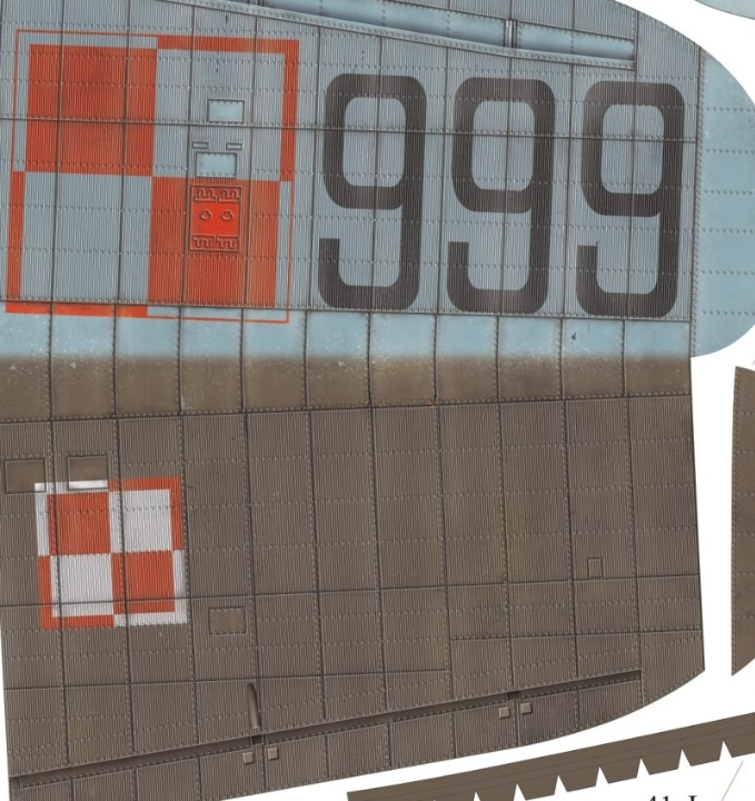 Close-up of a metallic aircraft or vehicle panel with large black '999' numerals, red and white checkered markings, and a light blue upper section.