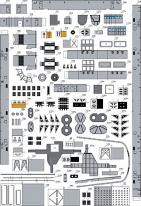 A detailed sheet of small gray and black molded parts with many numbered decals or components, laid out on a white background.
