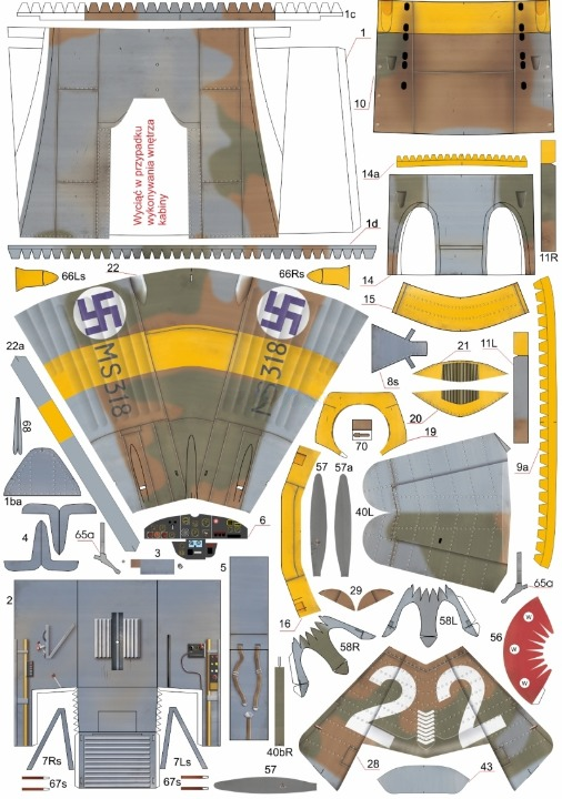 A sheet of model kit parts or decals laid out on a white background, featuring multiple labeled pieces in gray, brown, yellow, and black, including a large wing section with a purple swastika and other small aircraft components.