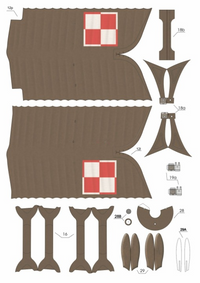 A flat lay of a papercraft kit showing various pre-cut cardboard pieces for a pirate ship, including the main hull, sails, and rigging, with some pieces highlighted in red and white.